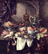 Still life with fruit, roast, silver- and glassware, porcelain and columbine cup on a dark tablecloth with white serviette.